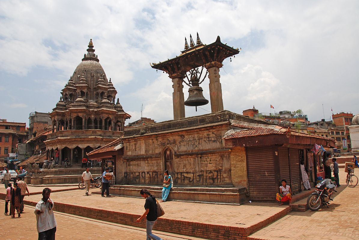 Kathmandu Patan Durbar Square 03 Krishna Temple and Taleju Bell The Krishna Temple (1723) is the octagonal white stone temple as you enter Patans Durbar Square from the south. The large bell hanging between two pillars on the right is Taleju Bell (1736).